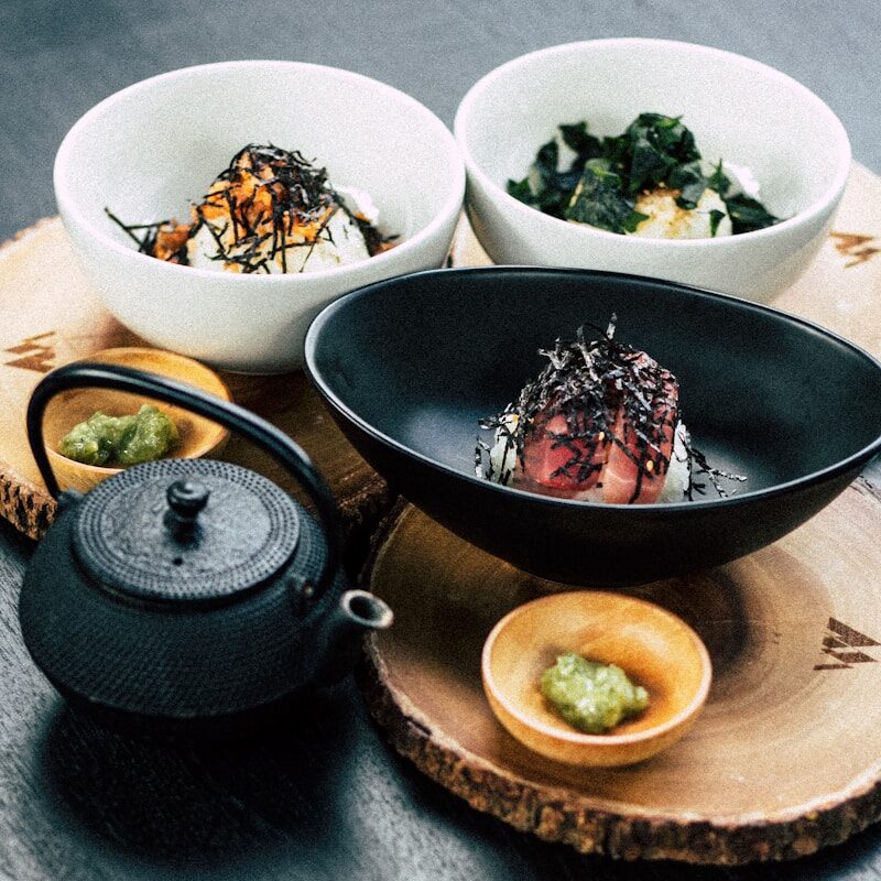 nigiri on black bowl with wasabe