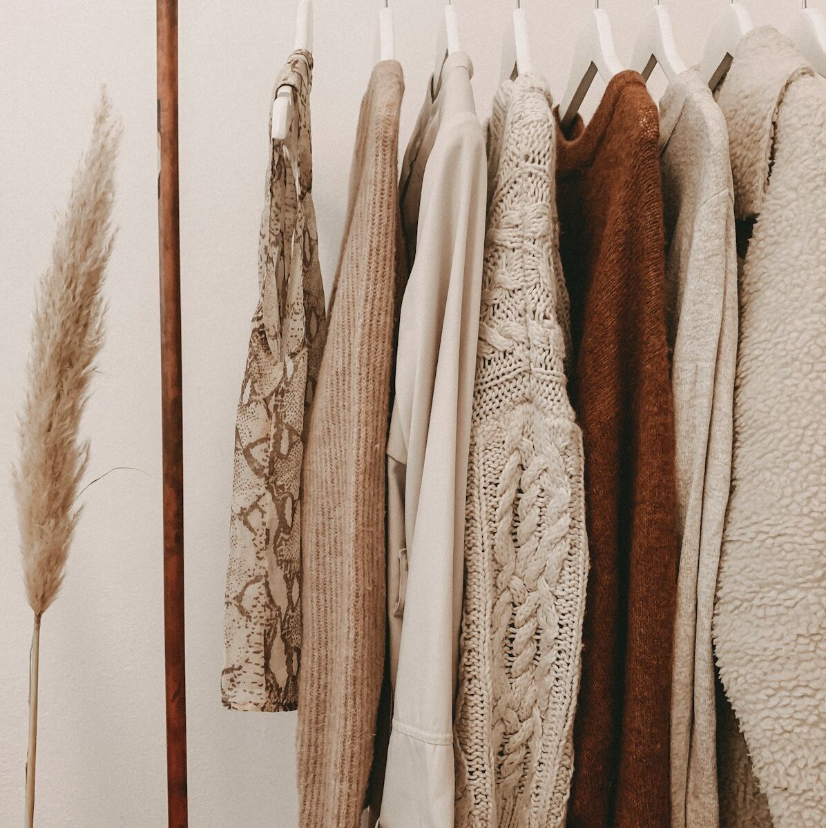 hanged top on brown and white clothes horse