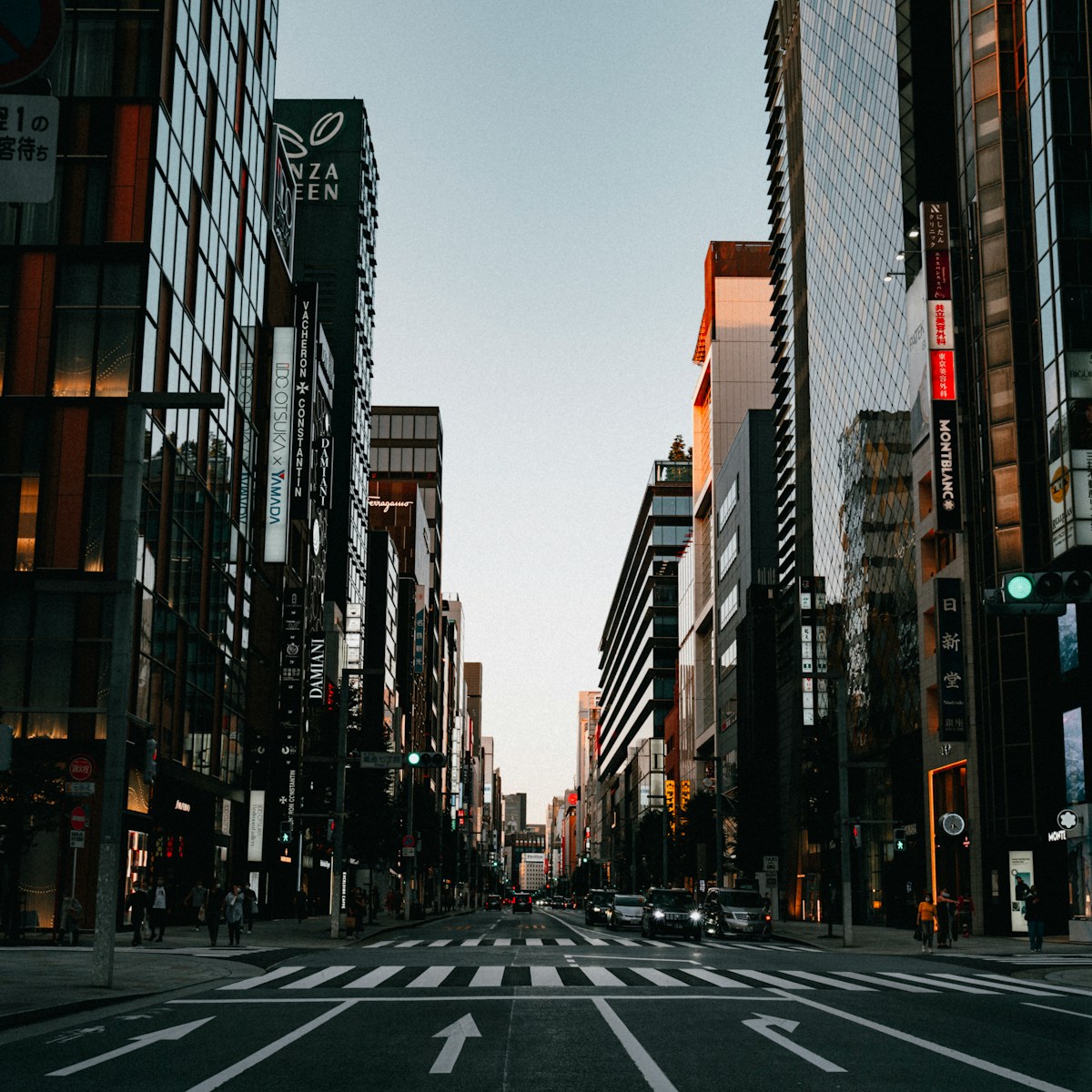 a city street filled with lots of tall buildings